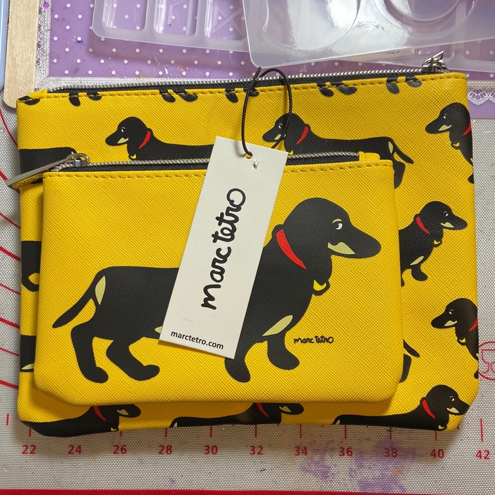 Duo of Marc Tetro dachshund travel bags